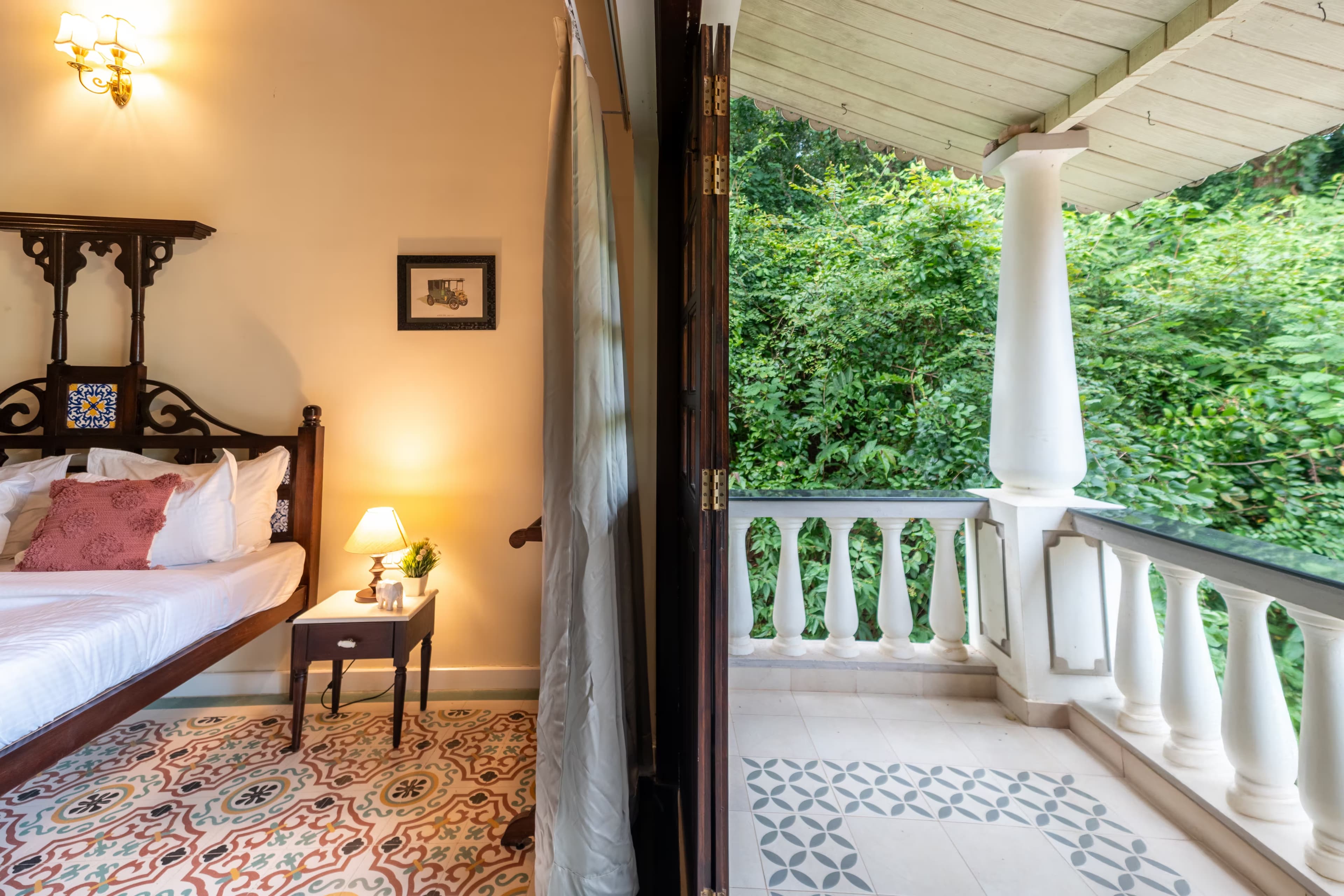 The Shioli House bedroom with balcony and tropical views in Siolim, North Goa