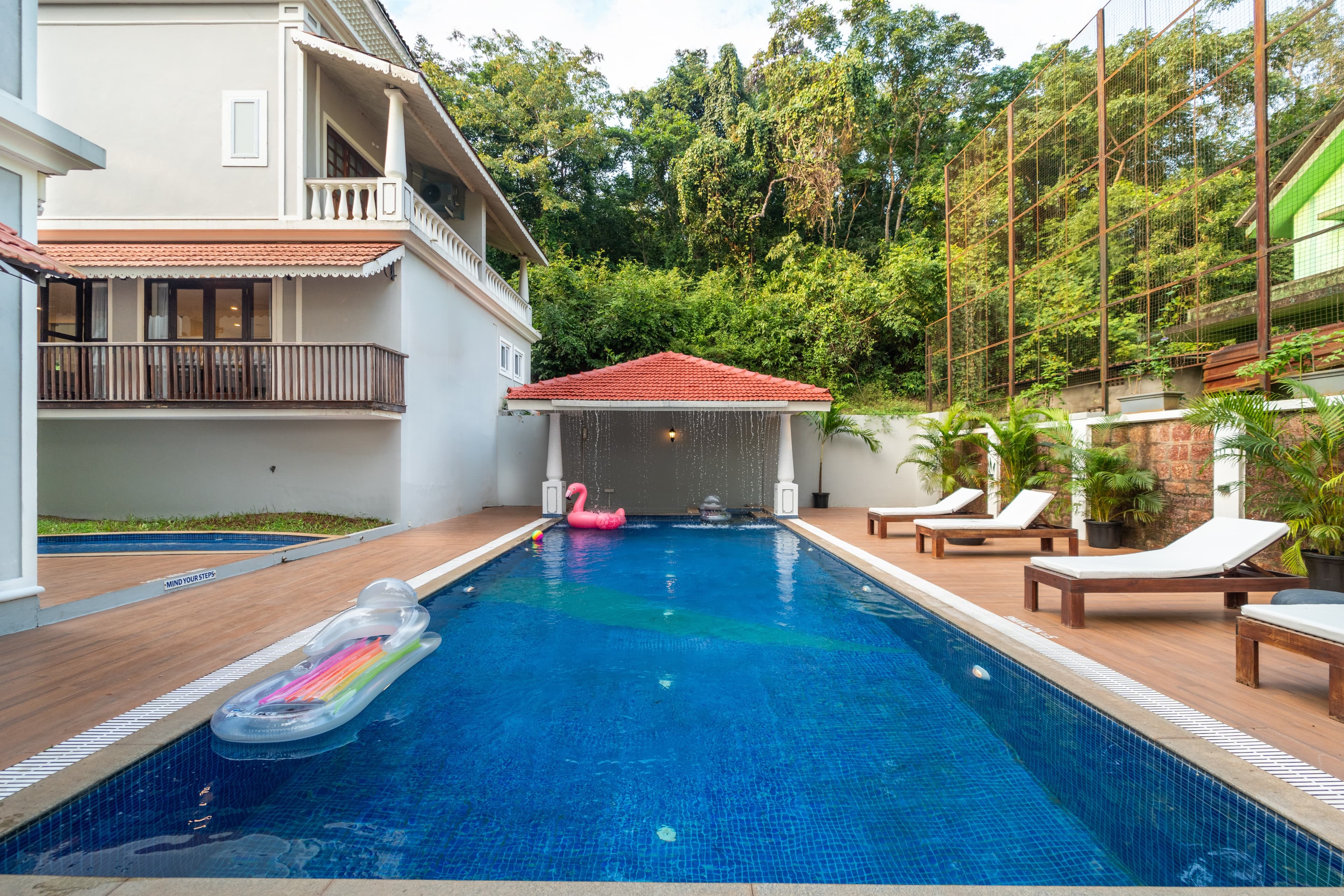 The Shioli House bedroom with warm heritage interiors in Siolim, North Goa
